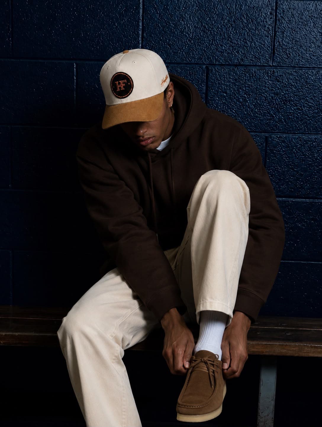 Model wearing the habfat HF Patch Cap in cream and tan